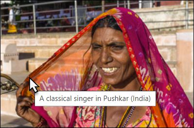 This Additional Piece of Information Was Added in the <img> Tag with “title="A classical singer in Pushkar (India)"”